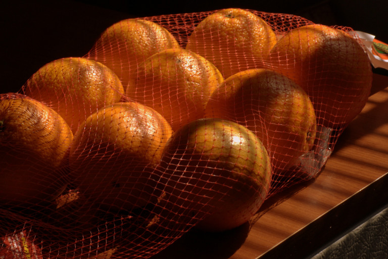 oranges in a netting bag